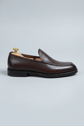 Brown slip-on leather formal shoes with a classic style for business attire.